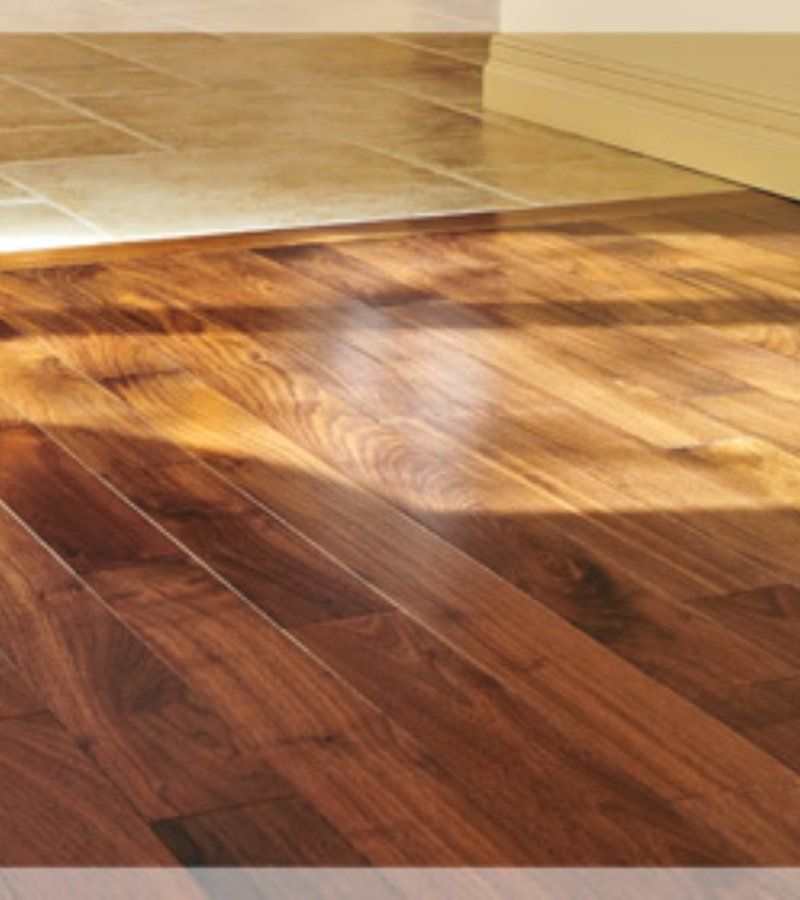 Beautifully polished hardwood floor showing rich grain and shine after professional cleaning