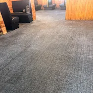 Commercial office carpet freshly cleaned showing clean dark pattern — Eugenia-Divine Casey review