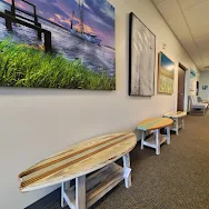 Clean commercial space with surfboard decor after Sano Steam cleaning — Omar Kharbat review